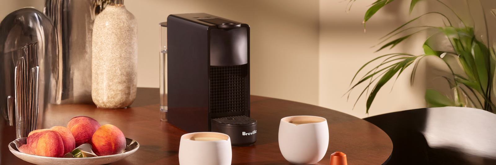 Click here to shop Nespresso Breville Essenza Mini coffee machine