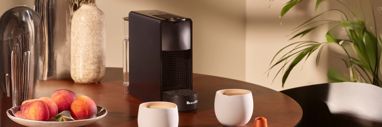 Click here to shop Nespresso Breville Essenza Mini coffee machine